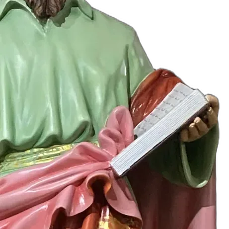 St Thomas the Apostle holding the open book of the Gospel: detail of a Simon Art Co. statue