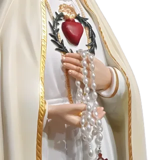 Our Lady of Fatima holding a white rosary, the Immaculate Heart on her breast: detail of a Simon Art Co. statue