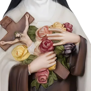 St Thérèse of Lisieux holding roses and a crucifix: detail of a Simon Art Co. statue