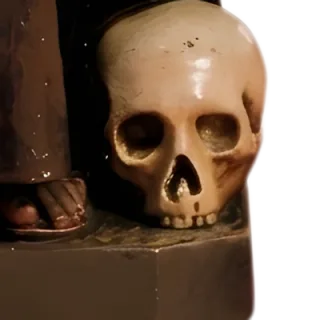 A skull at the feet of St Francis of Assisi: detail of a Simon Art Co. statue