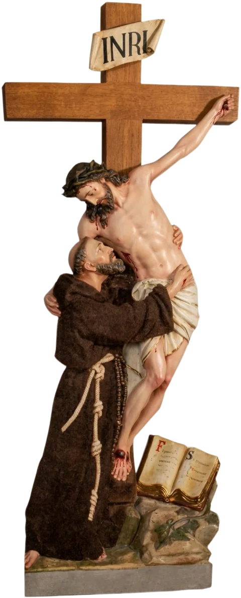 St Francis of Assisi statue embracing Christ on the cross as Christ reaches down to him, an open book at his feet, natural finish